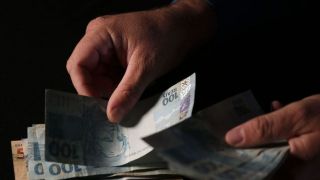 Caixa paga o Auxílio Brasil a beneficiários com Número de Inscrição Social com final 5
